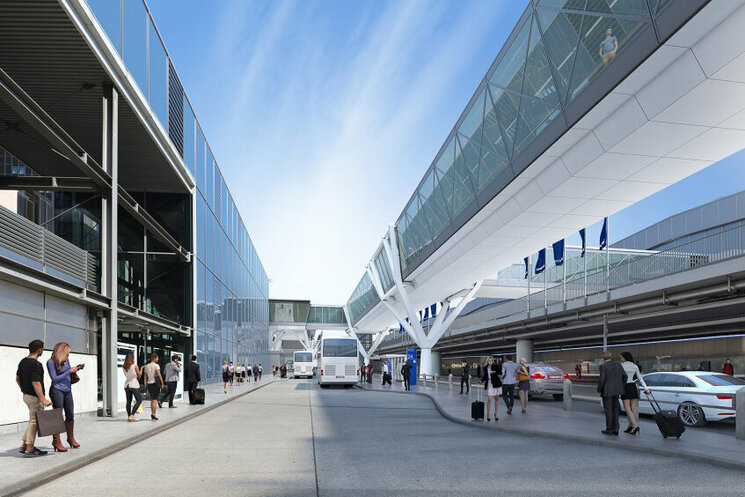 Ansicht auf das Gebäude mit Straße und laufenden Menschen